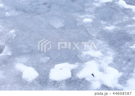 abstract winter background / gray ice with snow, background for text. abstract background cold with snowfall. 44608587