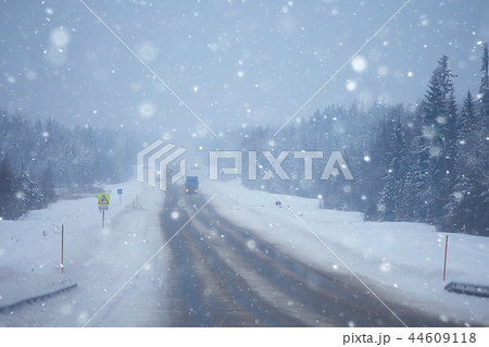 snow and fog on the winter road landscape / view of the seasonal weather a dangerous road, a winter lonely landscape 44609118