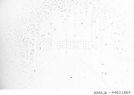 white isolated background water drops on the glass / wet window glass with splashes and drops of water and lime, texture autumn background white isolated background water drops on the glass / wet window glass with splashes and drops of water and lime, texture autumn background 44611864
