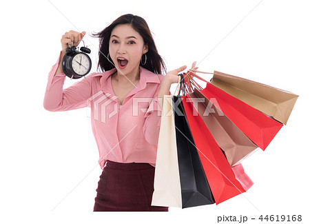 happy woman holding shopping bag and clock isolate on white back 44619168