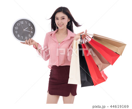 happy woman holding shopping bag and clock isolate on white back 44619169
