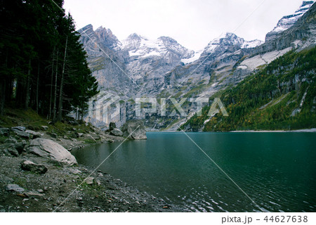 View of Oeschinen Lake in the Swiss alps with beautiful turquoise water. View of Oeschinen Lake in the Swiss alps with beautiful turquoise water. 44627638