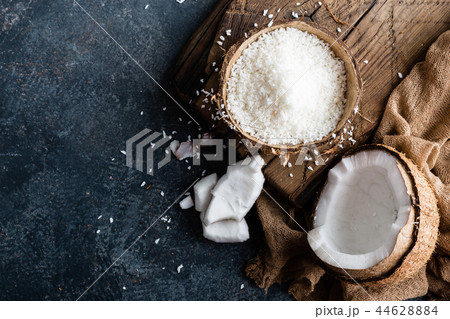 Coconut flakes in bowl 44628884