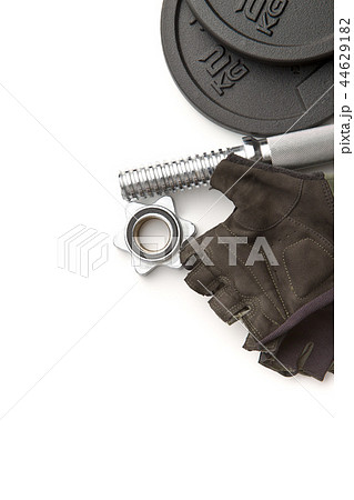 Dumbbell and fitness gloves. 44629182