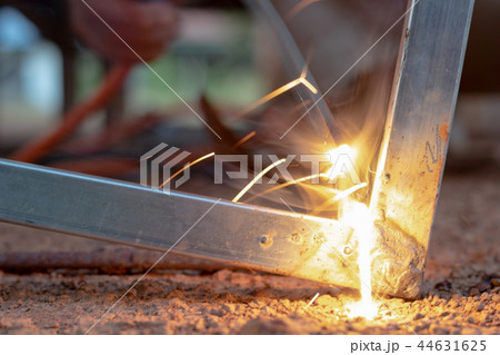 Technician focus on welding process on spark light 44631625