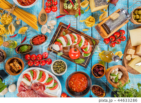 Various kind of italian food served on wood Various kind of italian food served on wood 44633286