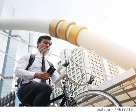 Business man bicycle walking and mobile phone. 44633719