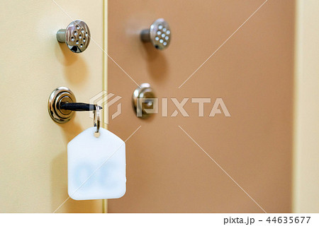 Wooden doors with key in sports gym locker room Wooden doors with key in sports gym locker room 44635677