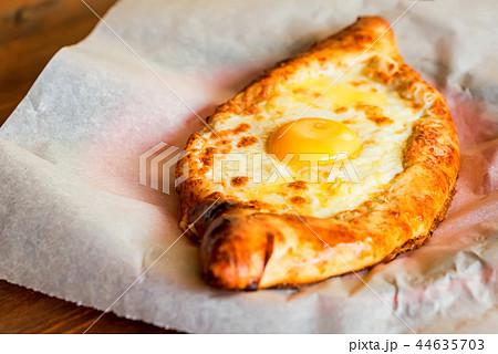 Ajarian khachapuri Georgian cheese pie with egg close 44635703