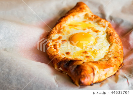 Ajarian khachapuri Georgian cheese pie with egg close 44635704