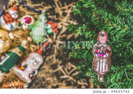 Box with vintage glass Christmas toys under the tr Box with vintage glass Christmas toys under the tr 44635742