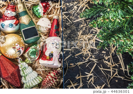 Box with vintage glass Christmas decorations view 44636301