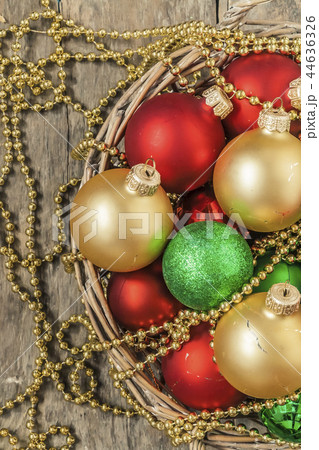 Christmas balls red, gold, green, beads lie in  44636326