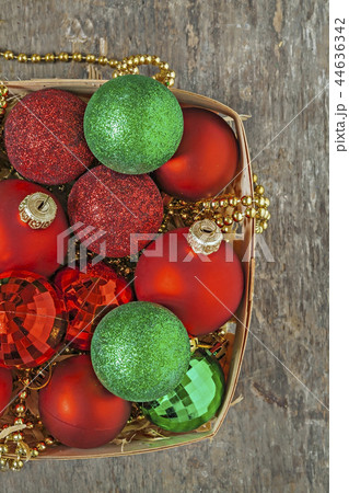 Christmas balls red, gold, green, beads lie in a Christmas balls red, gold, green, beads lie in a 44636342
