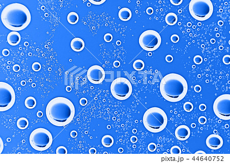 fresh drops background blue glass / wet rainy background, water drops transparent glass blue 44640752