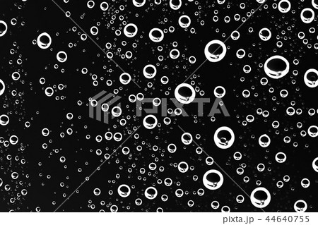 black wet background / raindrops for overlaying on window, concept of autumn weather, background of drops of water rain on glass transparent black wet background / raindrops for overlaying on window, concept of autumn weather, background of drops of water rain on glass transparent 44640755