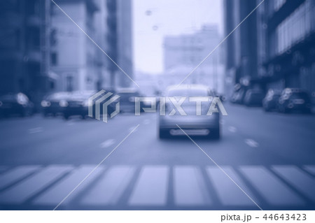 view of car in traffic jam / rear view of the landscape from window in car, road with cars, lights and the legs of the cars night view view of car in traffic jam / rear view of the landscape from window in car, road with cars, lights and the legs of the cars night view 44643423