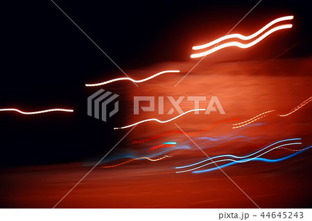traces of headlights glow / blurred background nocturnal traces of light, texture of a night city 44645243