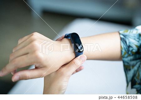 smart band, women touching fitness smart band 44658508