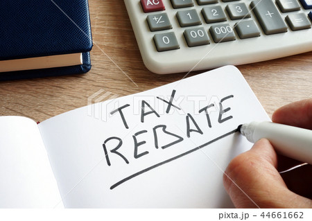 Tax rebate written by hand and money. Tax rebate written by hand and money. 44661662
