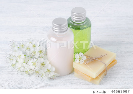 natural cosmetic bottle and handmade soap bar with fresh flowers 44665997