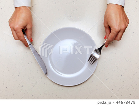 visitor which holds knife and fork 44673479