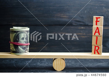 Dollars and the inscription "Fair" on wooden block Dollars and the inscription "Fair" on wooden block 44674560