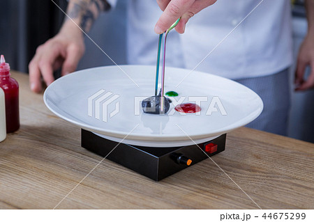 Young cooks trying molecular gastronomy in the kitchen Young cooks trying molecular gastronomy in the kitchen 44675299