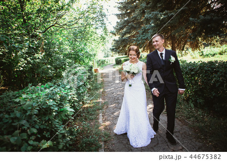 couple bride and groom on a park background 44675382