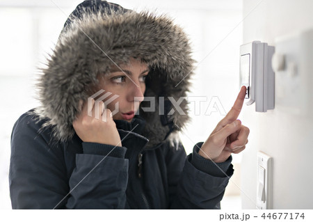 Woman With Warm Clothing Feeling The Cold Inside House Woman With Warm Clothing Feeling The Cold Inside House 44677174