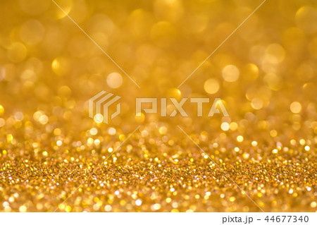 Gold sequins shine bright. Yellow powder. Glitter and bokeh lights 44677340