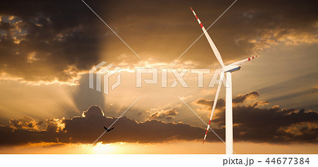 Wind generator on a background of sunset sky Wind generator on a background of sunset sky 44677384