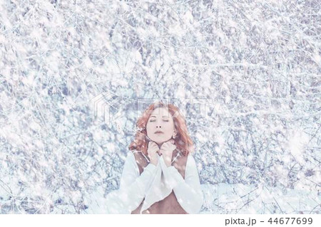 Woman walking in winter in the forest. Woman walking in winter in the forest. 44677699