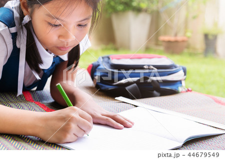 little girl writes to writing-book lessons 44679549