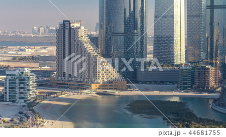 Buildings on Al Reem island in Abu Dhabi timelapse from above. 44681755