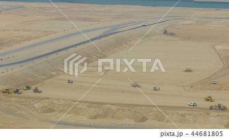 Soil compactor and bulldozer during road construction works timelapse 44681805
