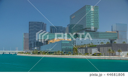 Modern buildings in Abu Dhabi skyline timelapse with mall and beach. 44681806