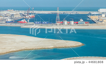 Big cargo ship at industrial port timelapse aerial fiew from above at evening in Abu Dhabi 44681808