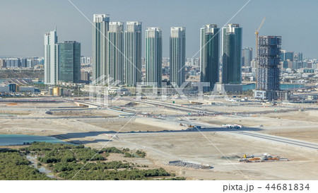 Buildings on Al Reem island in Abu Dhabi timelapse from above. 44681834