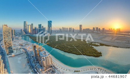 Buildings on Al Reem island in Abu Dhabi at sunset timelapse from above. Buildings on Al Reem island in Abu Dhabi at sunset timelapse from above. 44681907