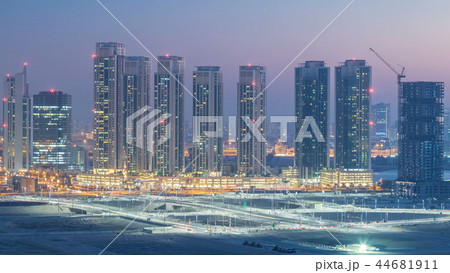 Buildings on Al Reem island in Abu Dhabi day to night timelapse from above. 44681911