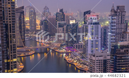 Beautiful aerial top view day to night transition timelapse of Dubai Marina canal 44682321