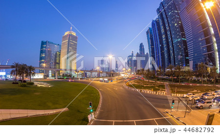 Traffic on intersection and bridge at the Sheikh Zayed Road day to night timelapse Traffic on intersection and bridge at the Sheikh Zayed Road day to night timelapse 44682792