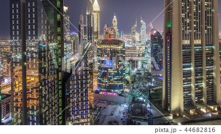 Skyline view of the buildings of Sheikh Zayed Road and DIFC night timelapse in Dubai, UAE. Skyline view of the buildings of Sheikh Zayed Road and DIFC night timelapse in Dubai, UAE. 44682816