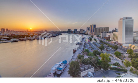 Dubai creek landscape at sunset timelapse with boats and ship near waterfront Dubai creek landscape at sunset timelapse with boats and ship near waterfront 44683306