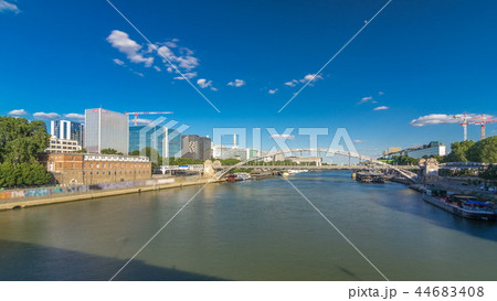 The Austerlitz viaduct in Paris timelapse hyperlapse, seen from bank of the river Seine with a metro train passing 44683408
