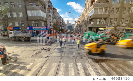 Tractor, roller on the road repair site timelapse. Road construction equipment. 44683410