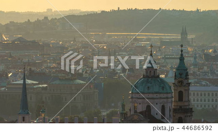 Spires of the old town and St Nicolas church at sunrise timelapse. czech republic, prague Spires of the old town and St Nicolas church at sunrise timelapse. czech republic, prague 44686592