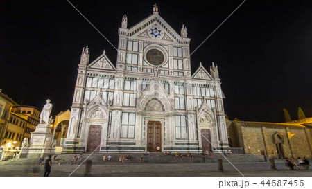 Tourists on Piazza di Santa Croce at night timelapse hyperlapse with Basilica di Santa Croce Basilica of the Holy Cross in Florence city. 44687456