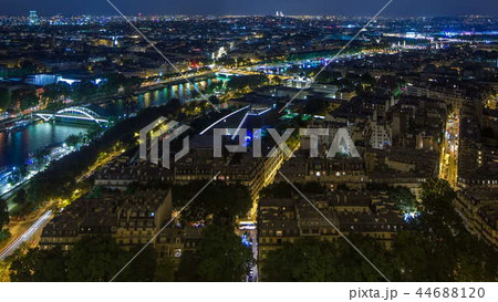 Aerial Night timelapse view of Paris City and Seine river shot on the top of Eiffel Tower Aerial Night timelapse view of Paris City and Seine river shot on the top of Eiffel Tower 44688120